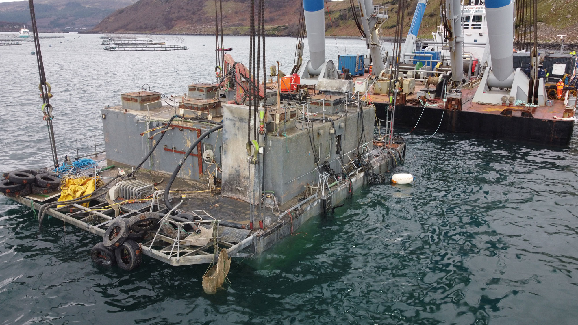 Salvage salmon fish feed barge at Skye Island